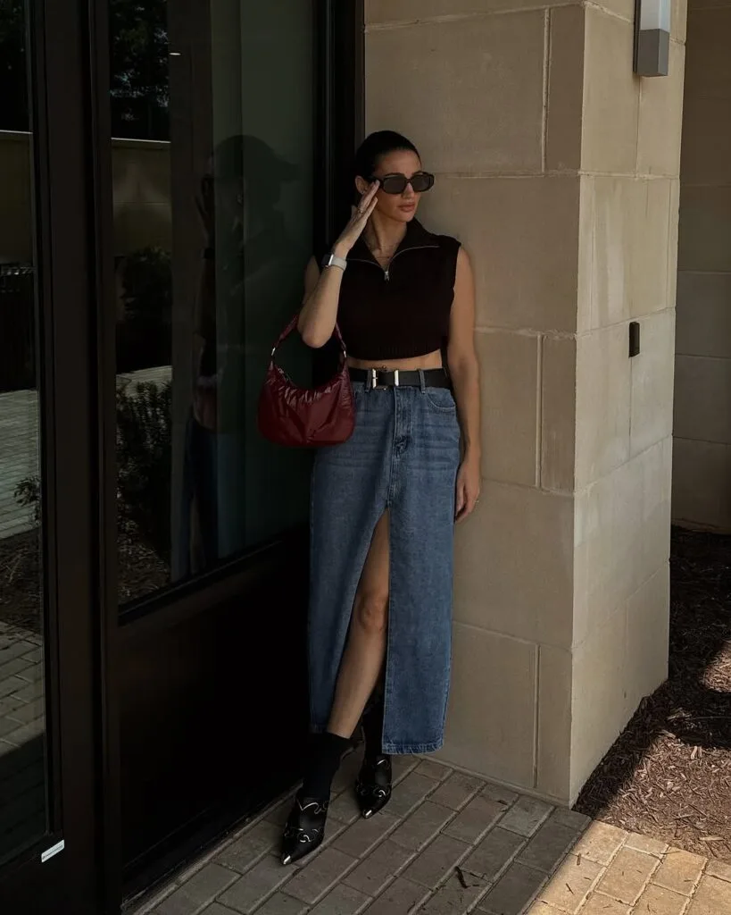 Black crop top denim midi skirt and red shoulder bag New York outfit