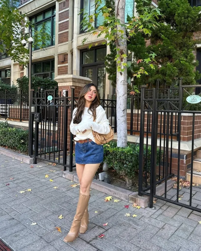 Oversized sweater denim mini skirt and tan boots autumn outfit