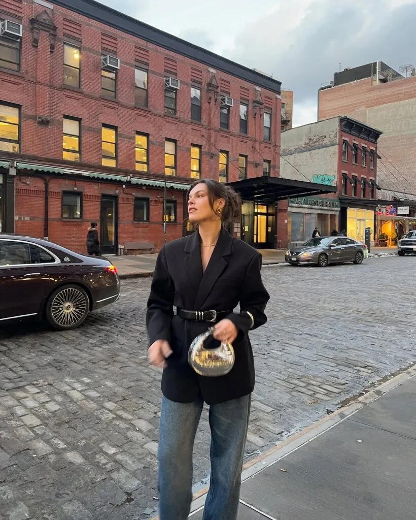 Belted black blazer with relaxed blue jeans New York outfit