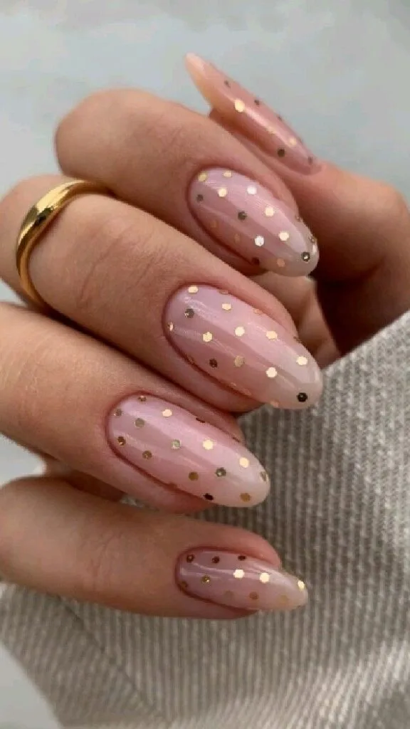 Blush polka dot August nails with soft pink polish and playful dotted accents
