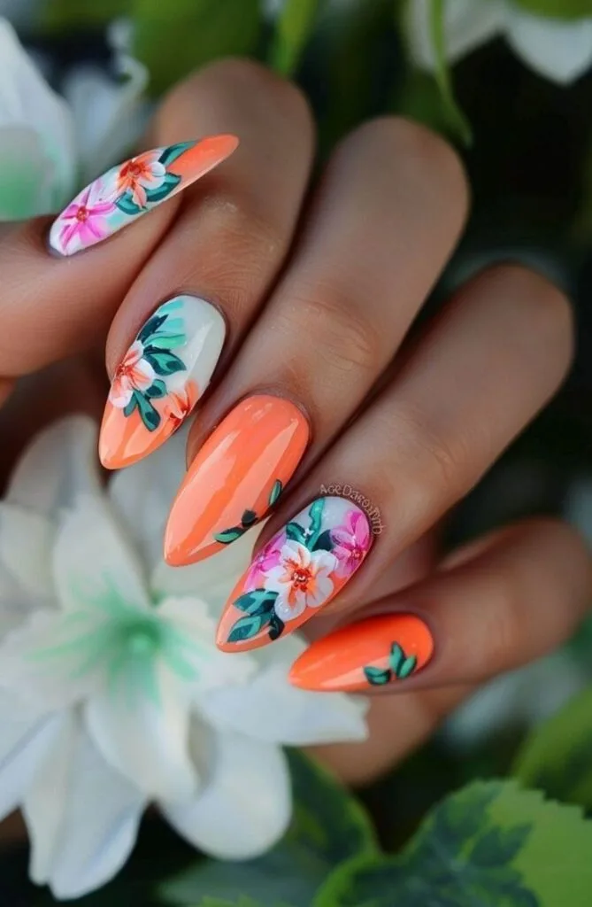 Coral floral August nails featuring bright coral tones and cheerful flower artwork.