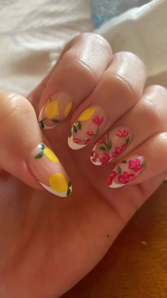 Lemon and rose garden French August nails featuring floral French tips and citrus accents.