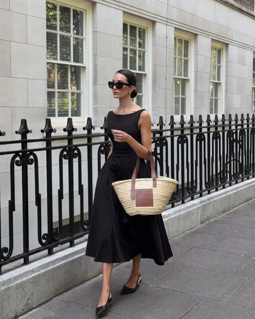 Sleeveless black satin midi dress