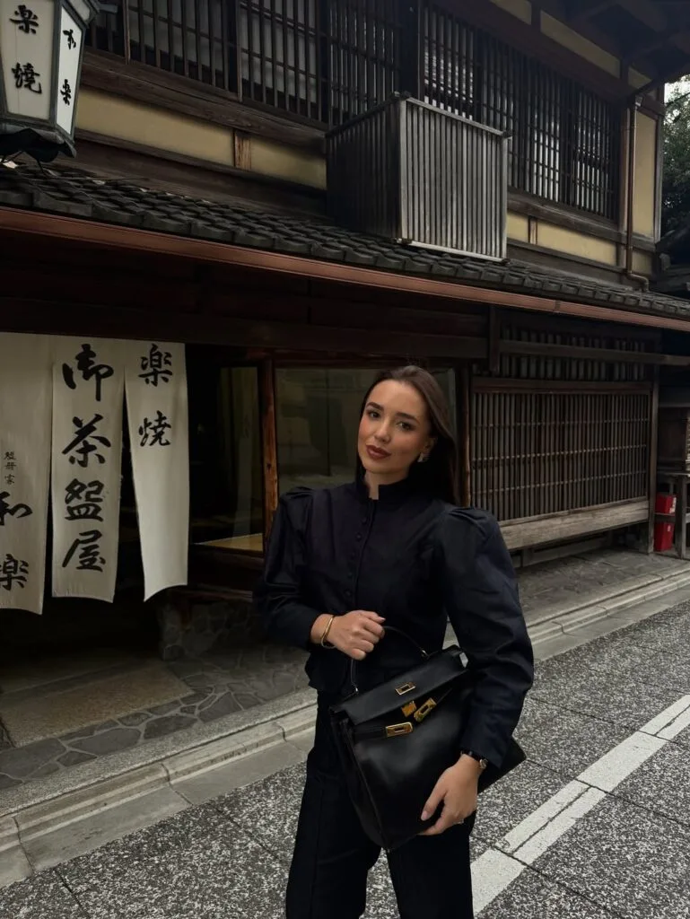 Puff sleeve black blouse with tailored trousers