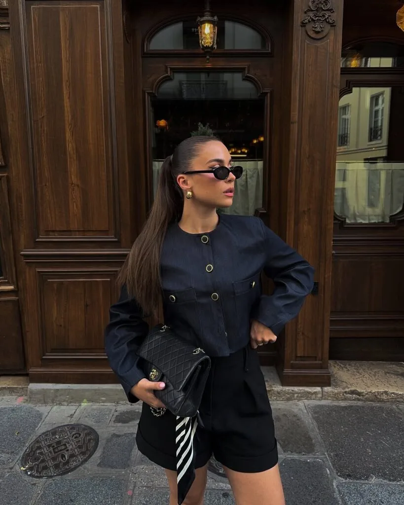 Black denim jacket with tailored shorts