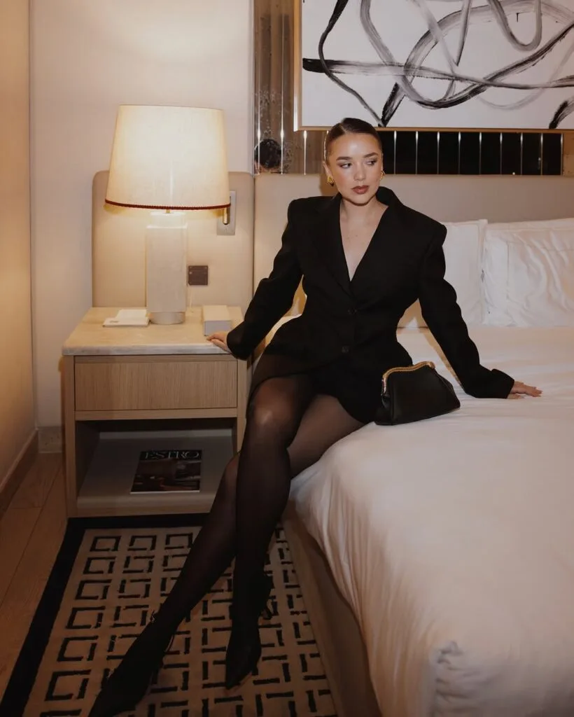 Tailored black blazer dress with sheer tights