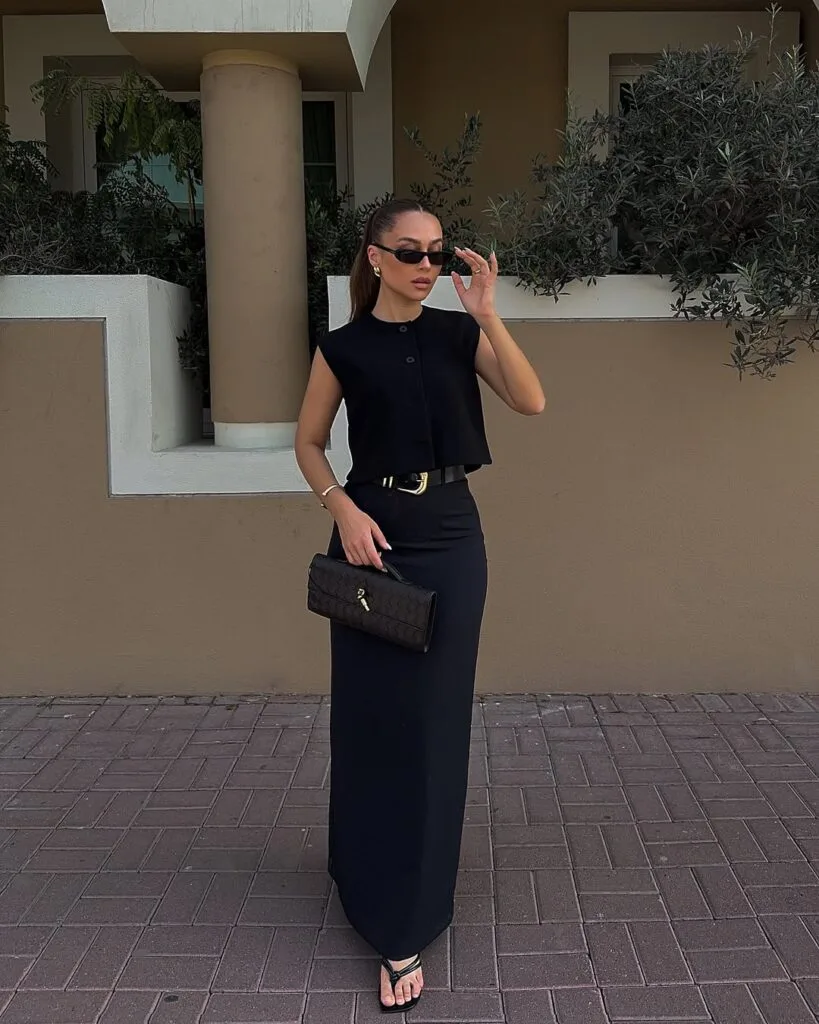 Cropped black top with belted maxi skirt