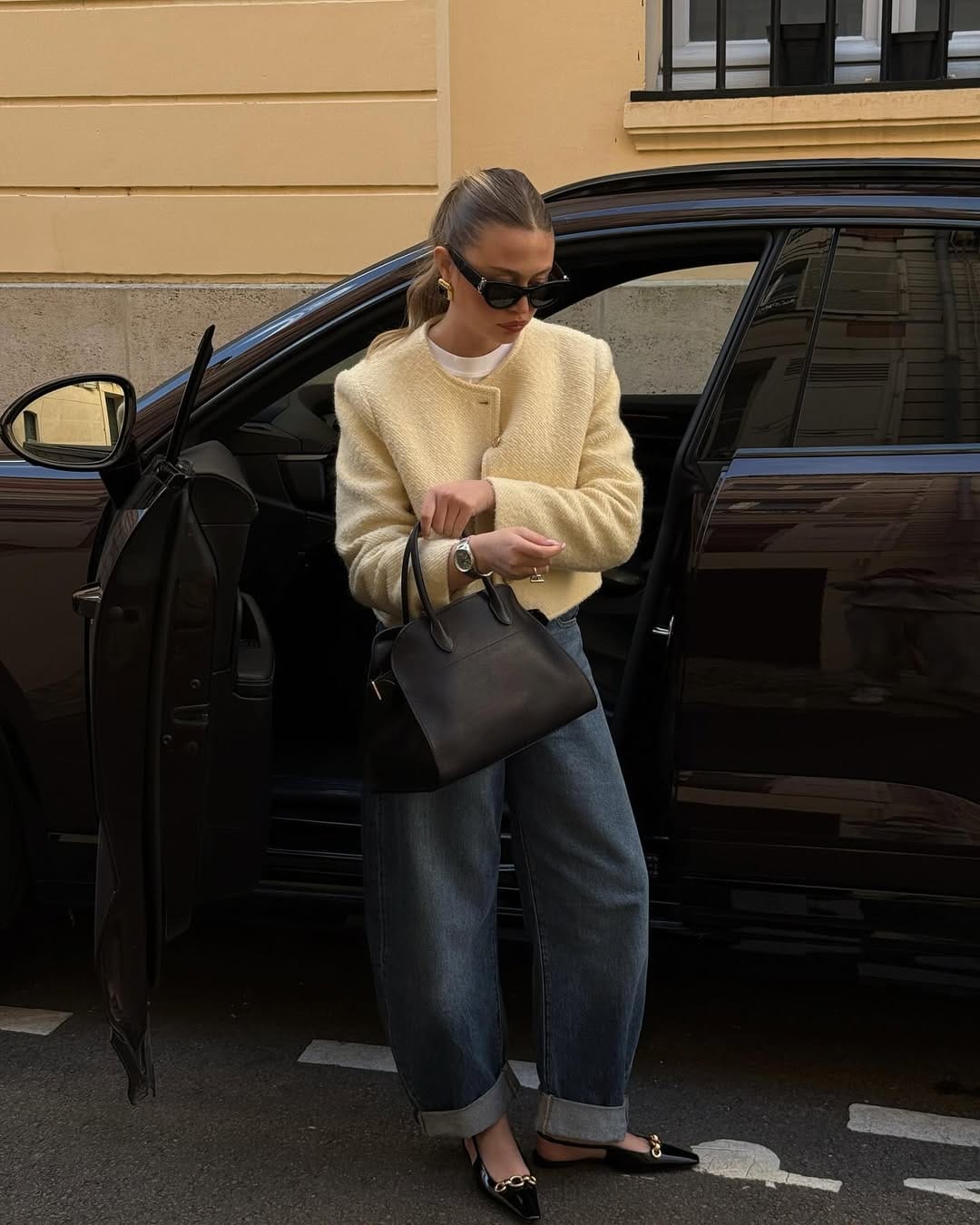 Butter yellow bouclé jacket with barrel-leg jeans elevated casual outfit
