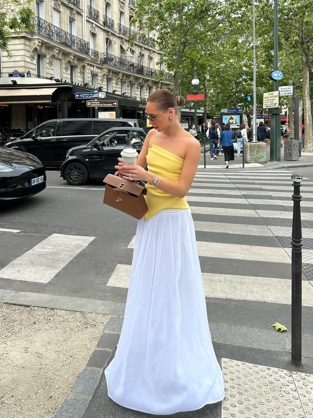 Butter yellow one-shoulder top with white pleated maxi skirt elegant look