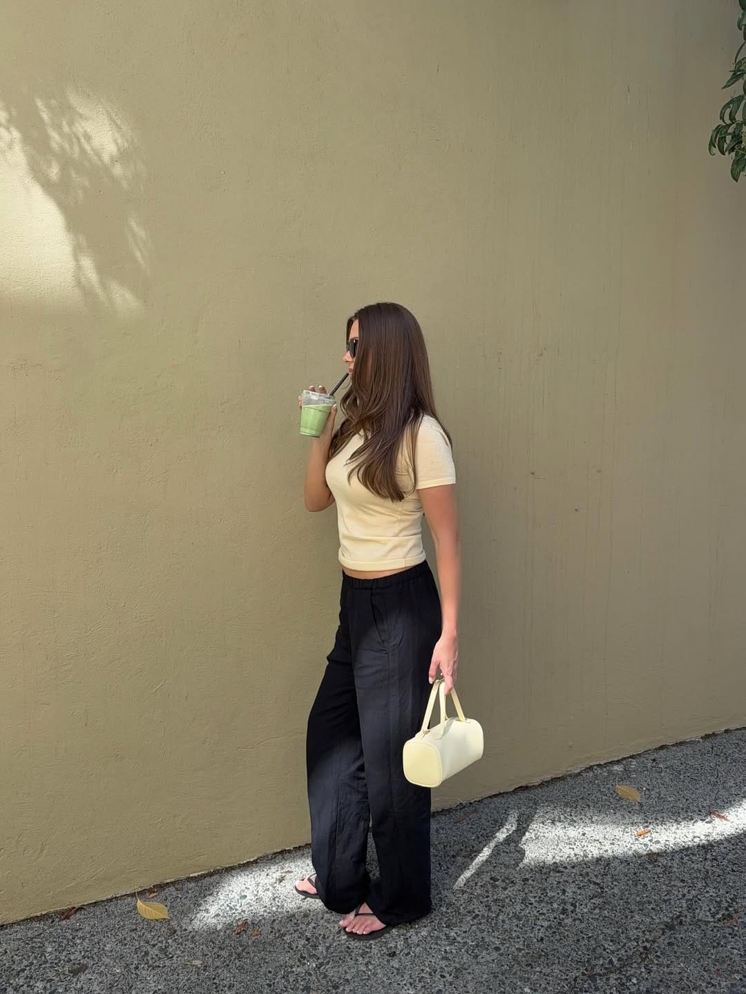 Butter yellow cropped t-shirt with black wide-leg trousers casual outfit