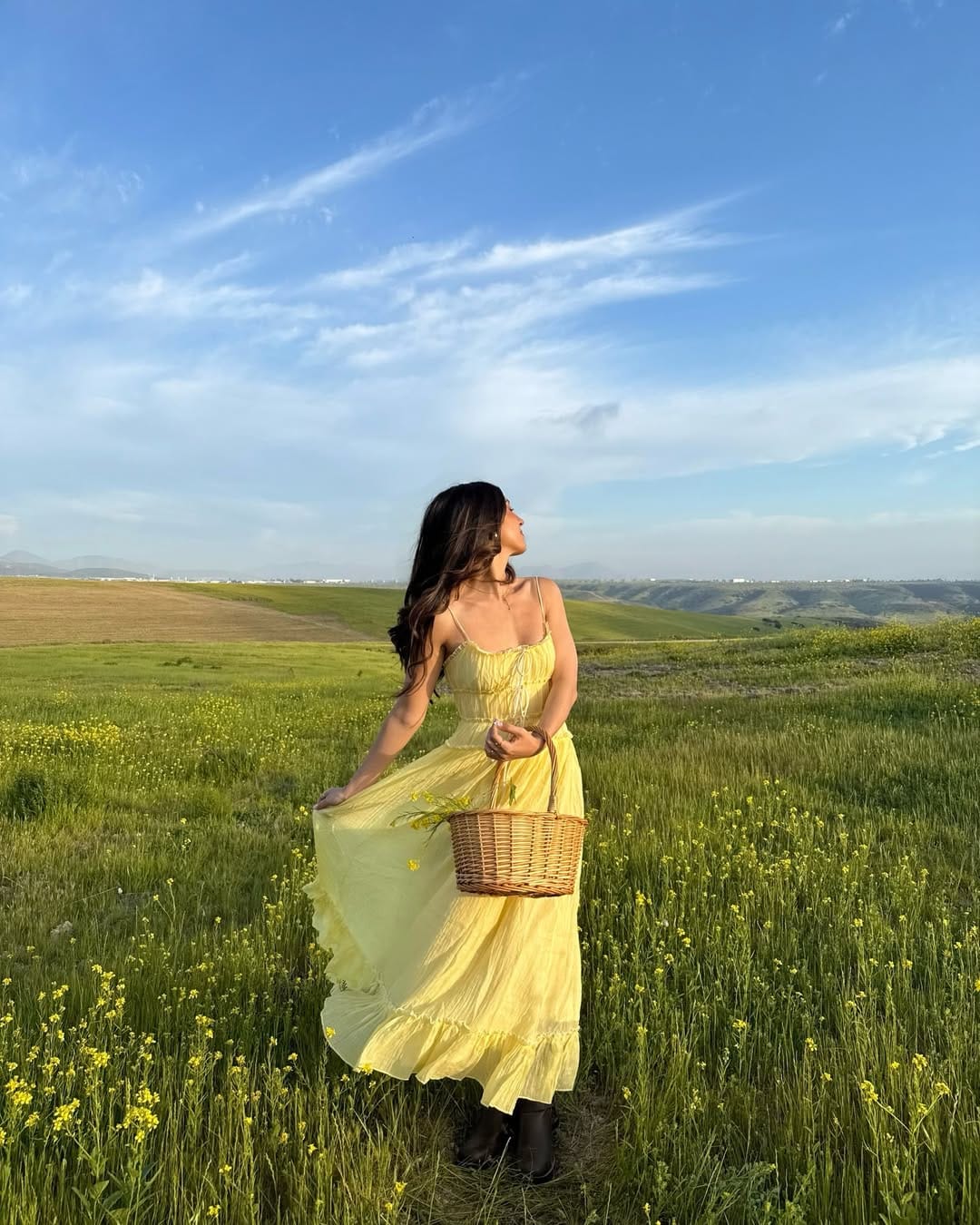 Butter yellow chiffon slip midi dress with dark boots and wicker basket contrast look