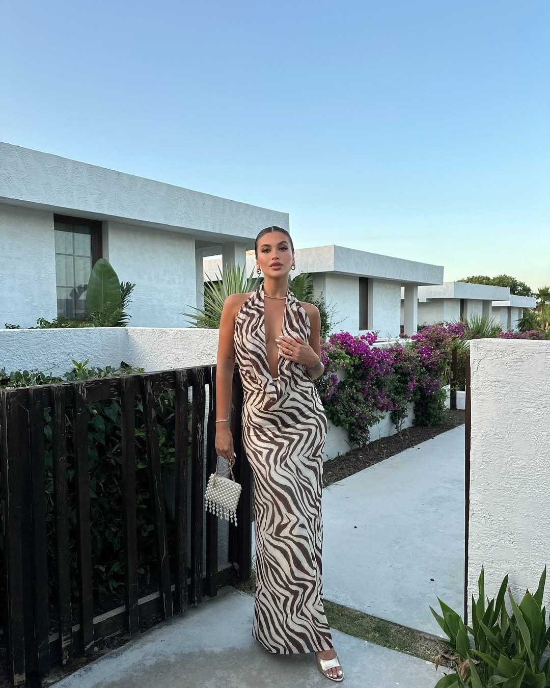 Zebra print halter maxi dress with deep plunge bold vacation style