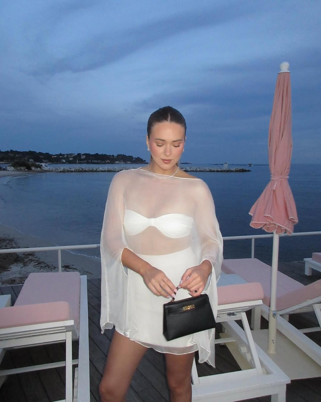 Sheer cape mini dress with structured bustier statement vacation outfit