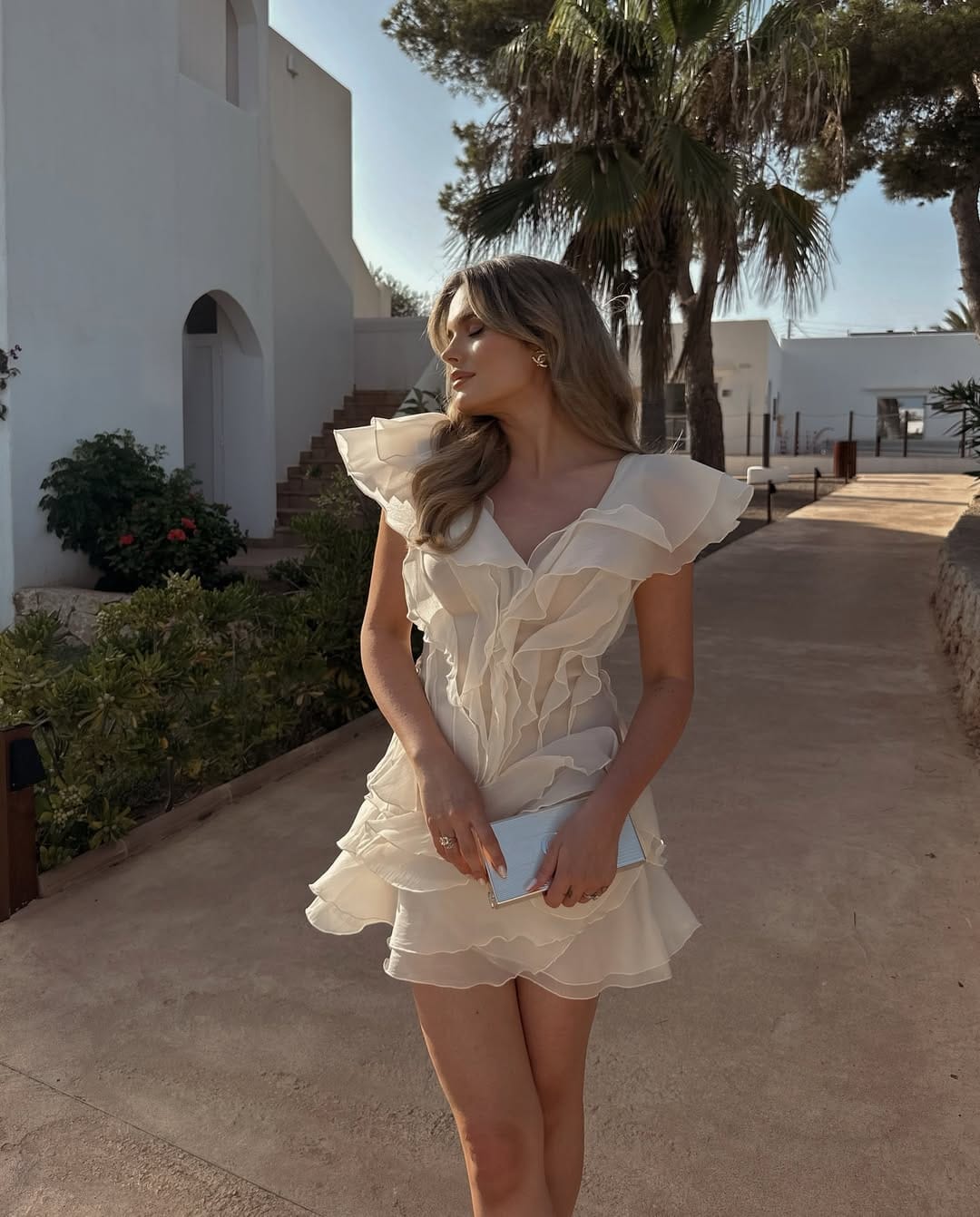 Ruffled ivory mini dress with soft layers romantic summer look