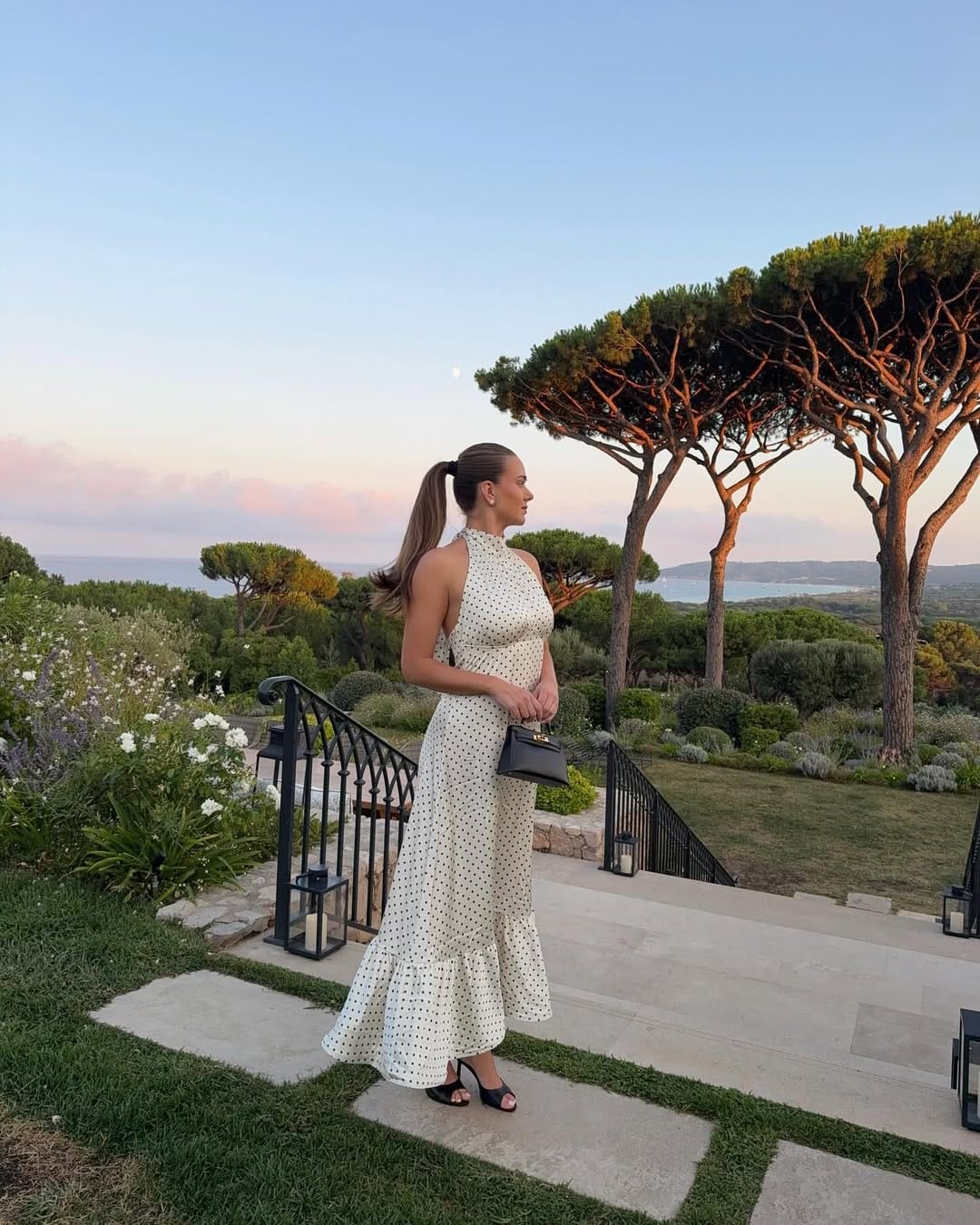 Cream and black polka dot halter neck maxi dress with ruffle hem