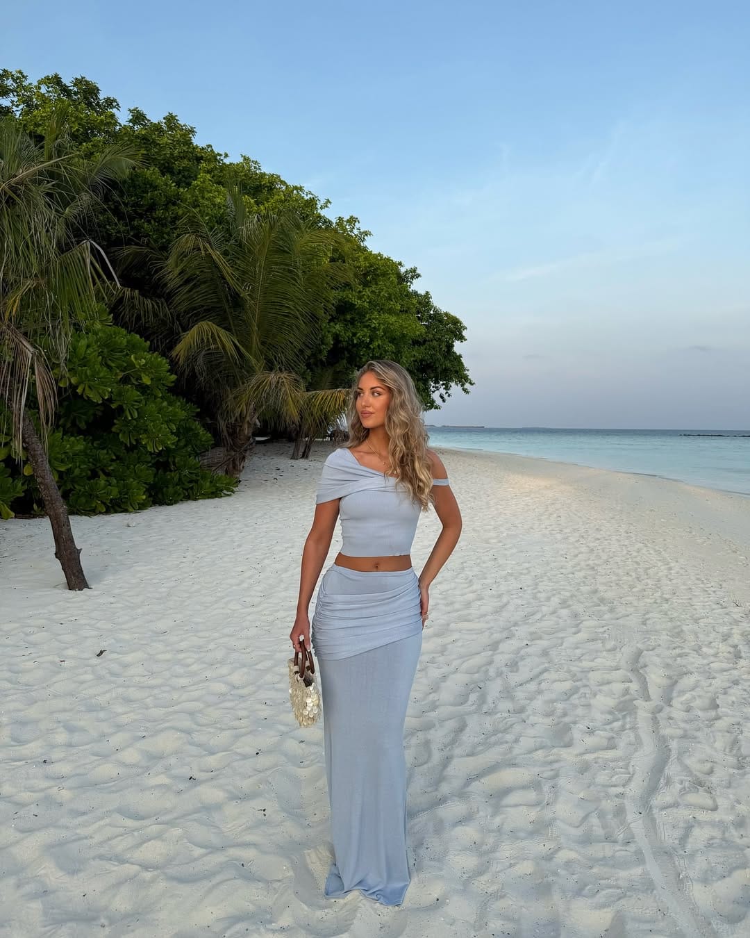 Powder blue off-shoulder crop top with matching ruched maxi skirt on Maldives beach outfit idea
