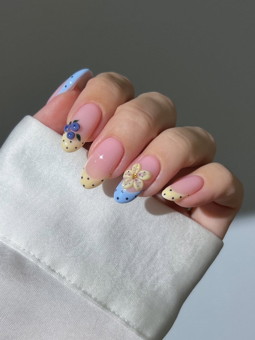 Butter yellow nails with periwinkle blueberry flower designs