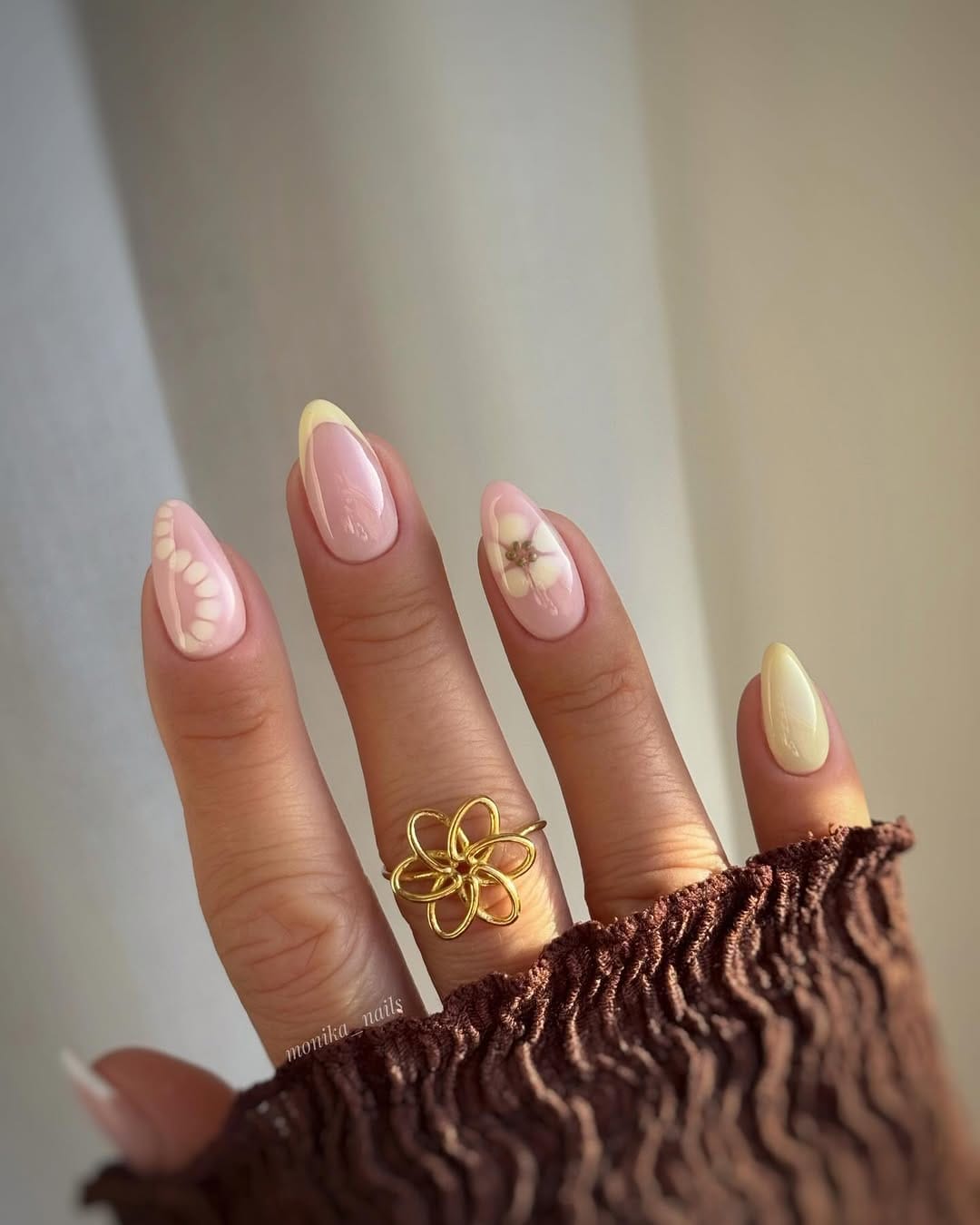Butter yellow French tips with pressed flower and dot detailing