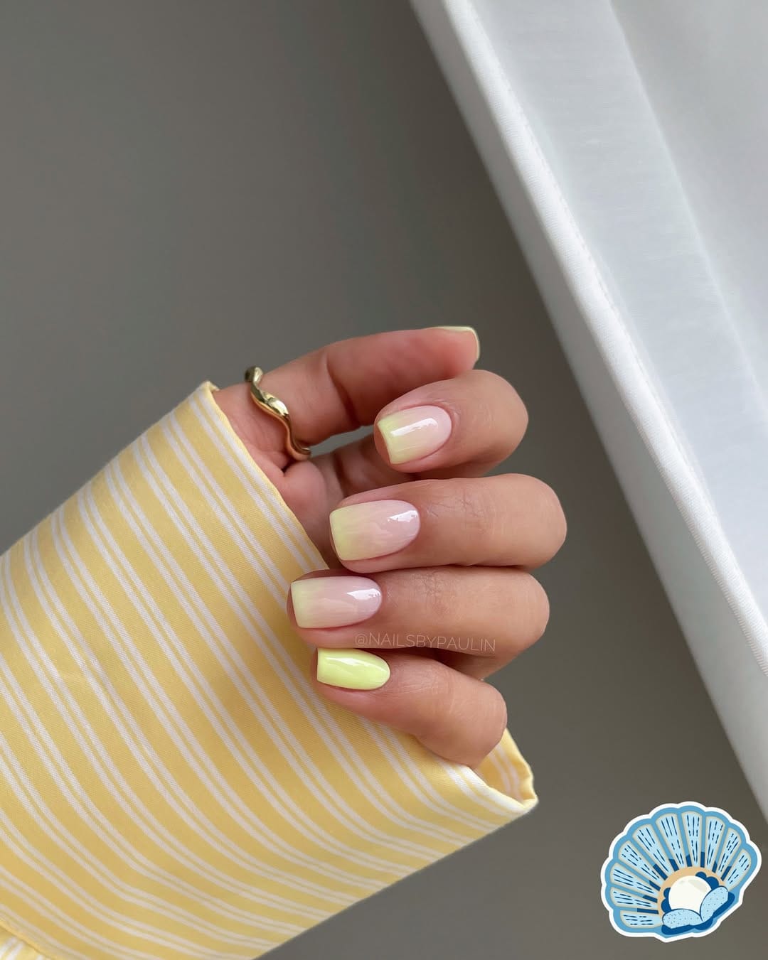 Butter yellow ombrƩ fade square nails with a soft gradient effect