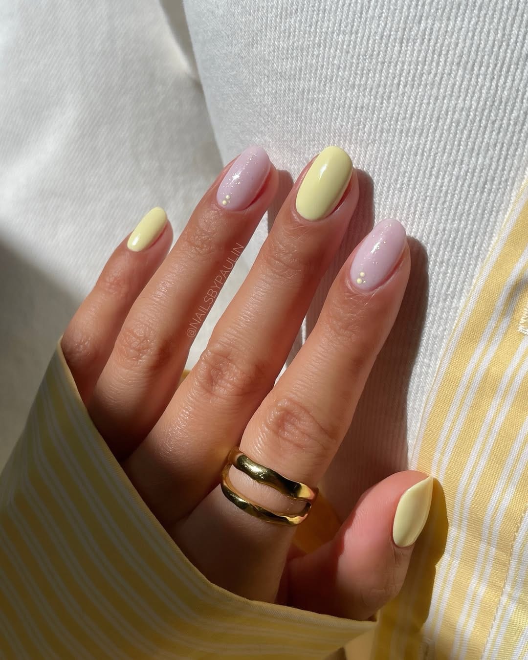 Butter yellow and lilac round nails with pearl dot accents