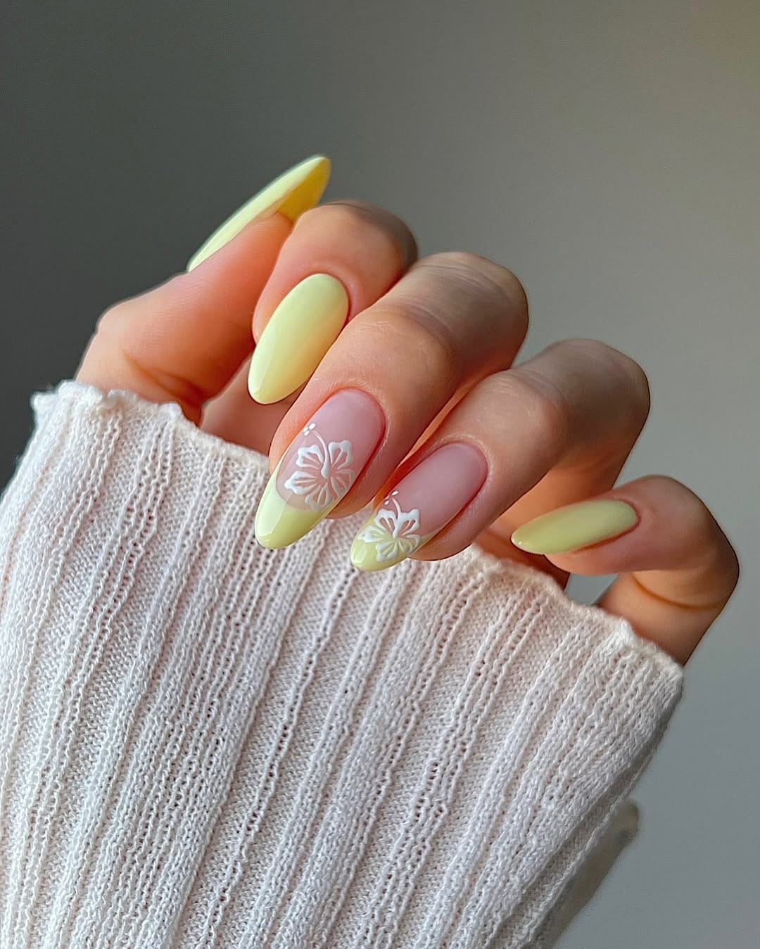 Butter yellow almond nails with white butterfly nail art