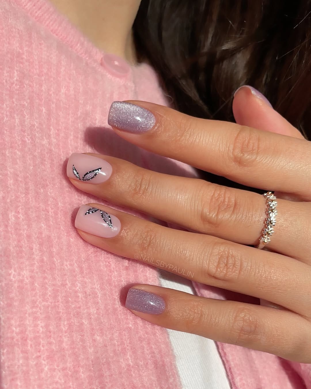 Lilac glitter square nails with minimal butterfly wing line art