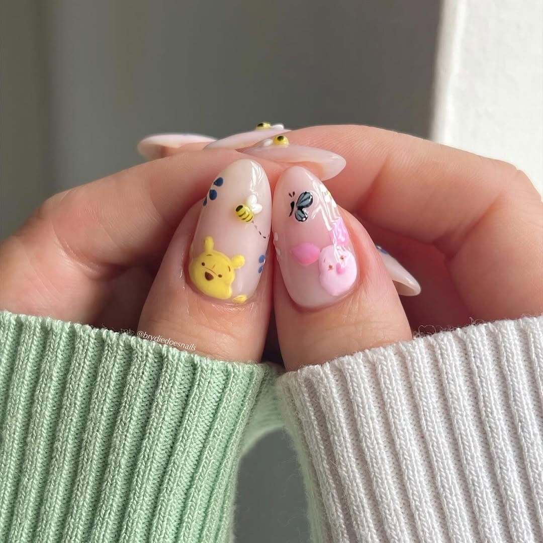 Sheer almond nails with hand-painted butterfly and bee garden scene