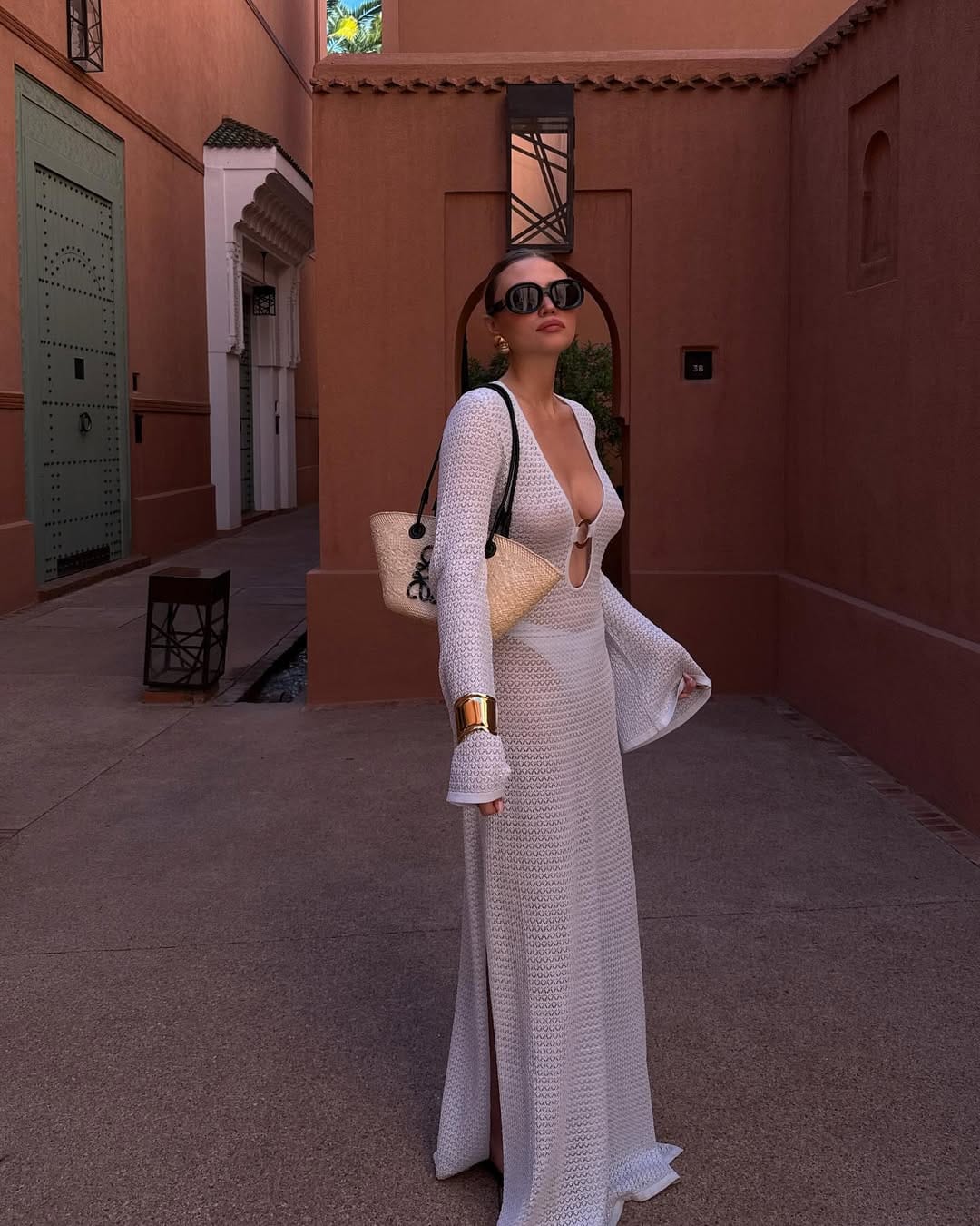 White deep V crochet maxi dress with dramatic bell sleeves