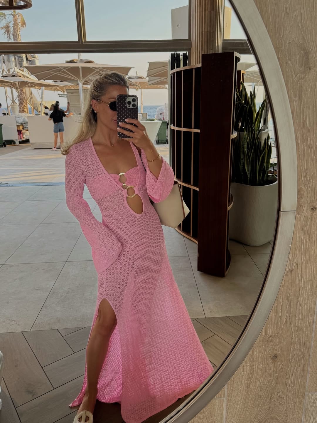 Pink crochet midi dress with ring hardware details for a statement look