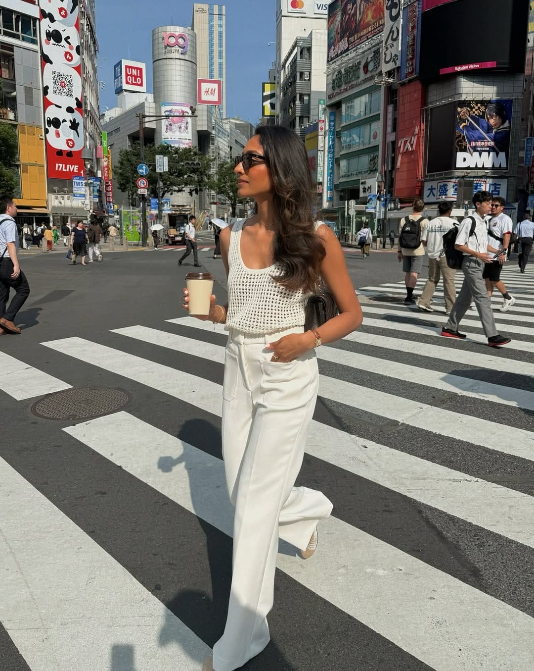 Ivory crochet tank top paired with white wide-leg trousers for a clean outfit