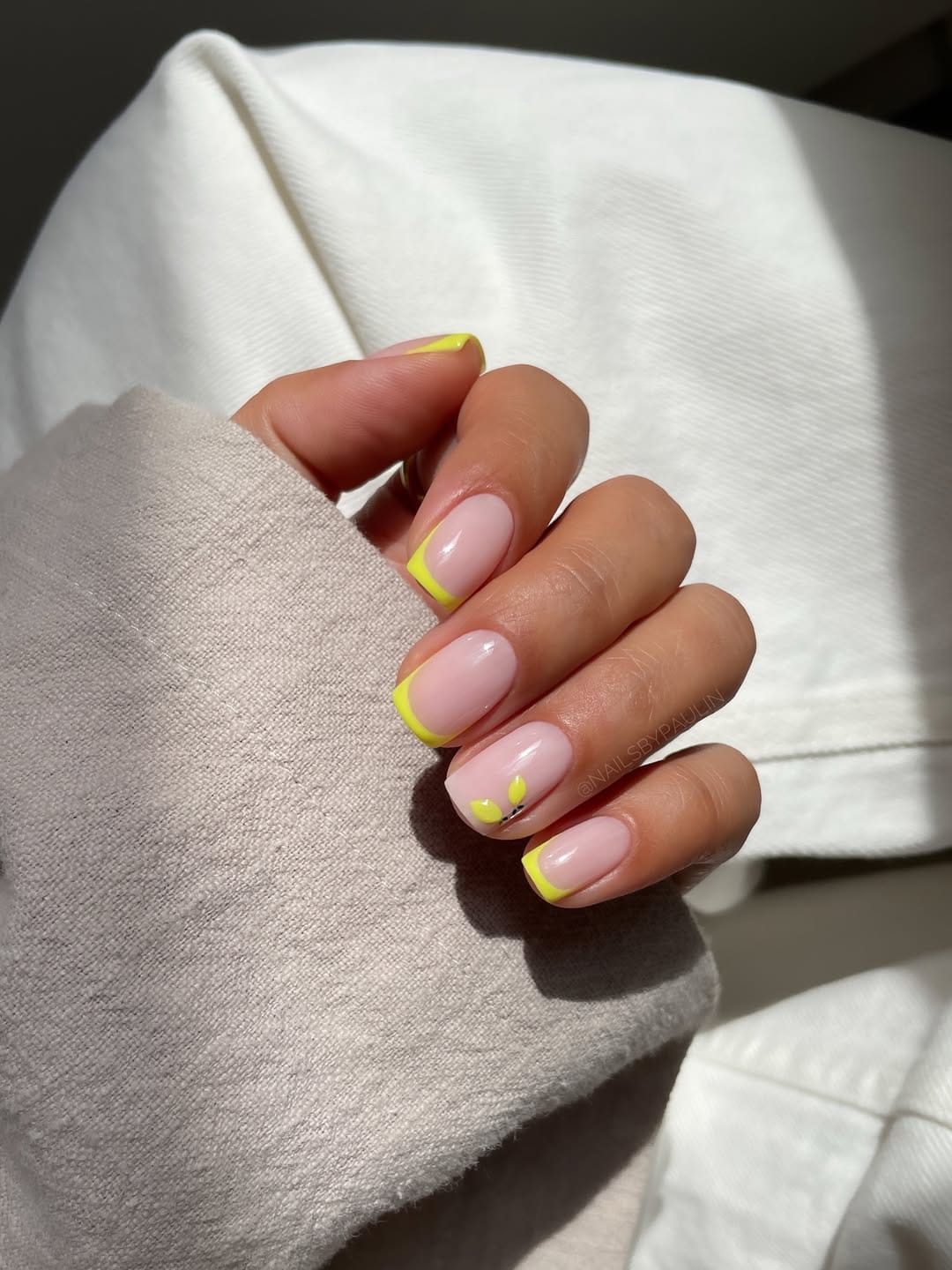 Neon yellow French tip short square nails with micro leaf detail