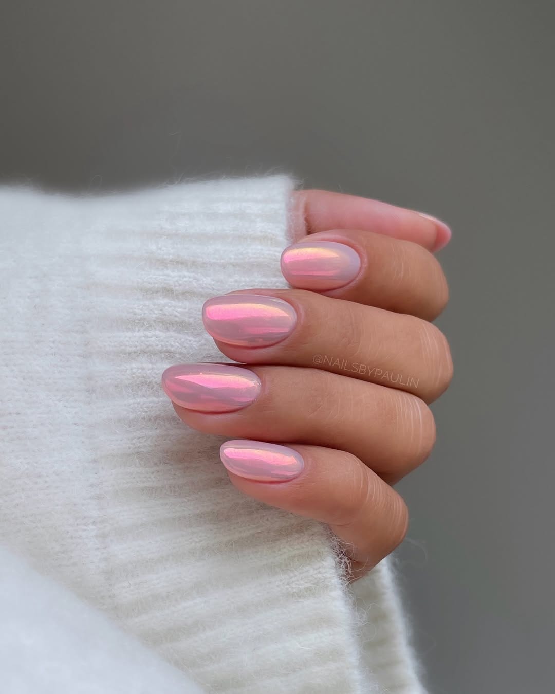 Sheer pink oval nails with iridescent aurora chrome finish