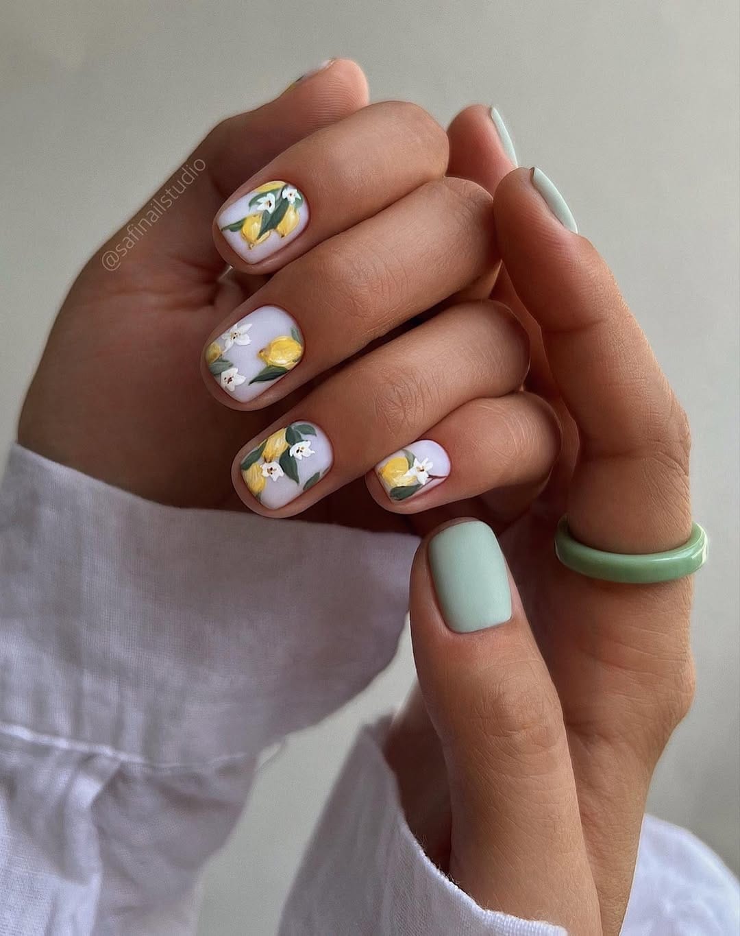 Soft lavender short square nails with lemon and white blossom nail art