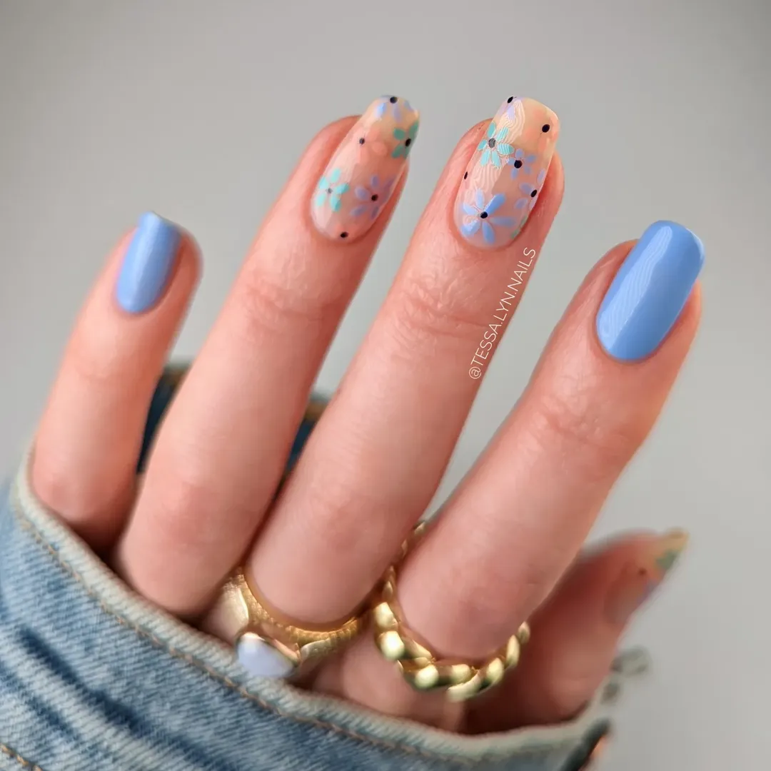 Periwinkle blue short square nails with peach floral accent design