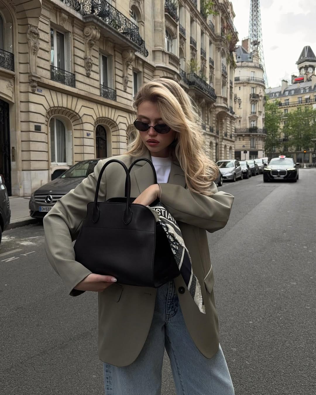 Khaki oversized blazer paired with wide-leg jeans and a Dior scarf