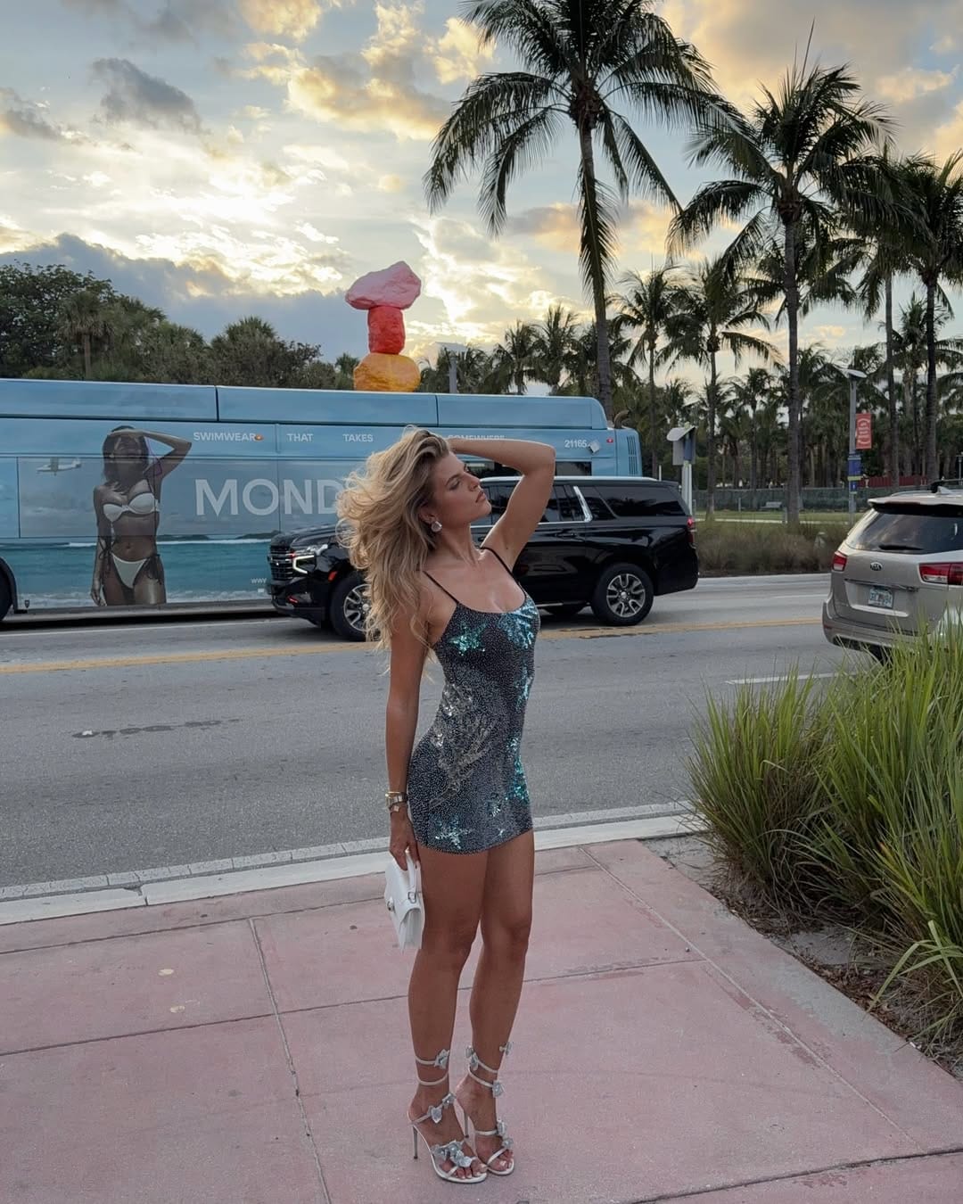 Gunmetal and teal sequin mini dress with strappy heels for a night concert outfit.