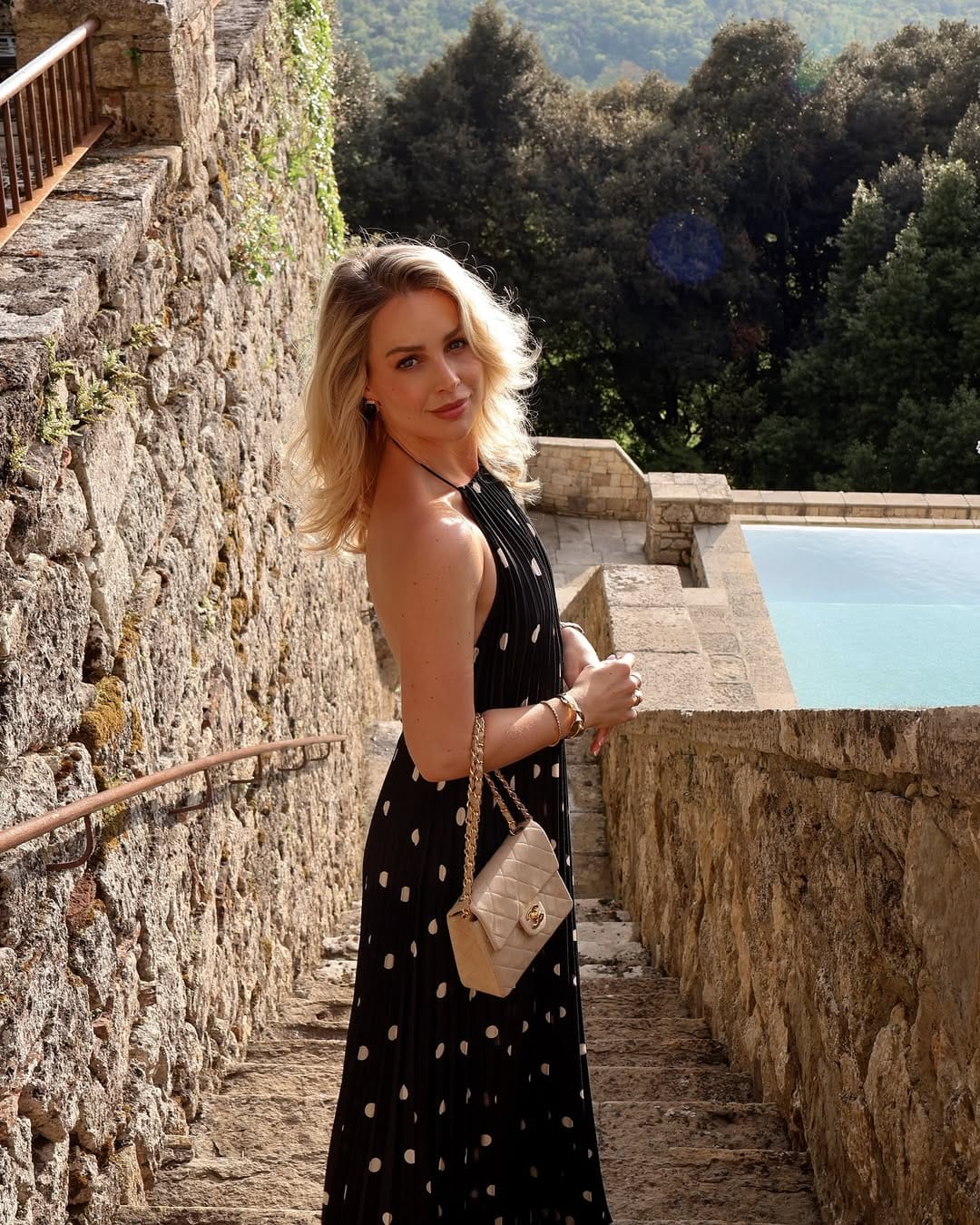 Black polka dot halterneck backless maxi dress with a flirty and elegant silhouette