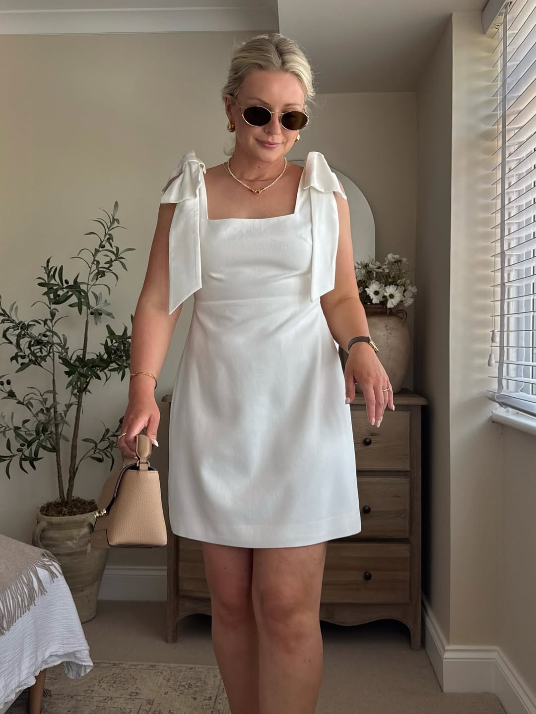 White linen tie-shoulder mini dress with a relaxed yet chic feel