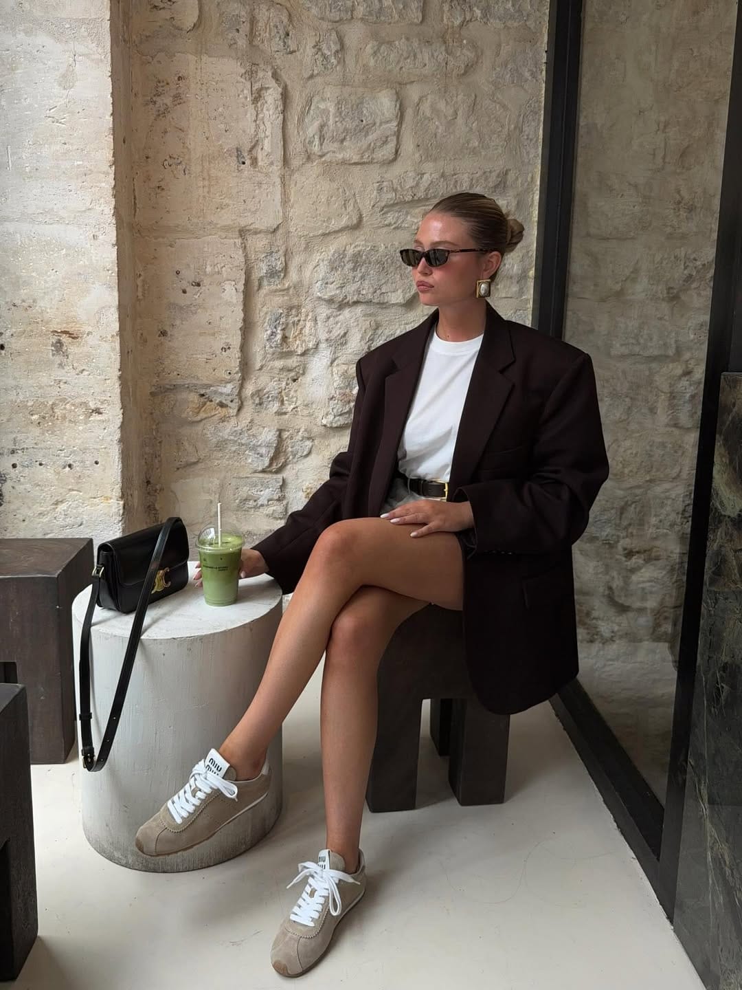 Dark chocolate blazer styled with a white tee and leather mini skirt