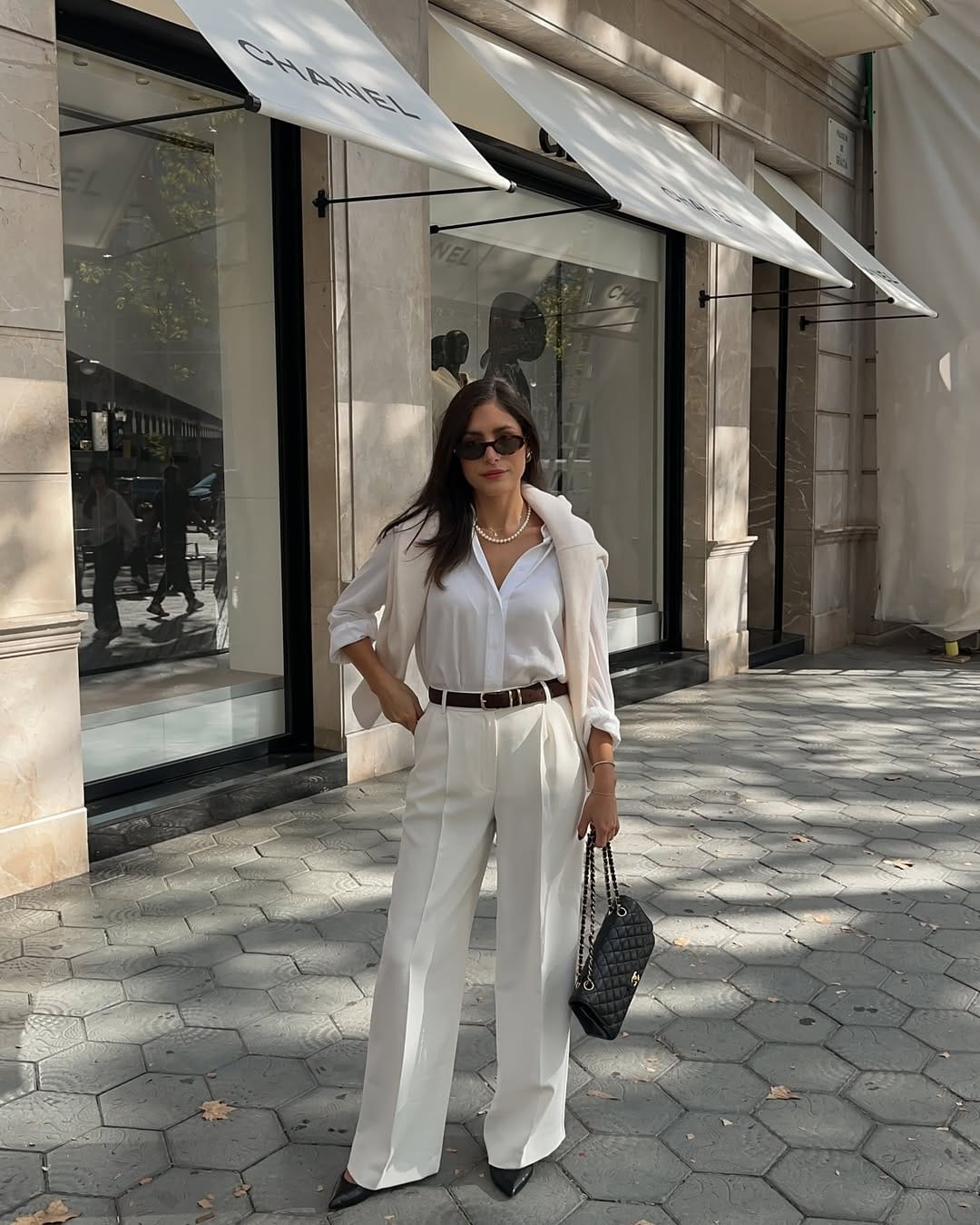 All-white suit with pearl necklace classy professional outfit