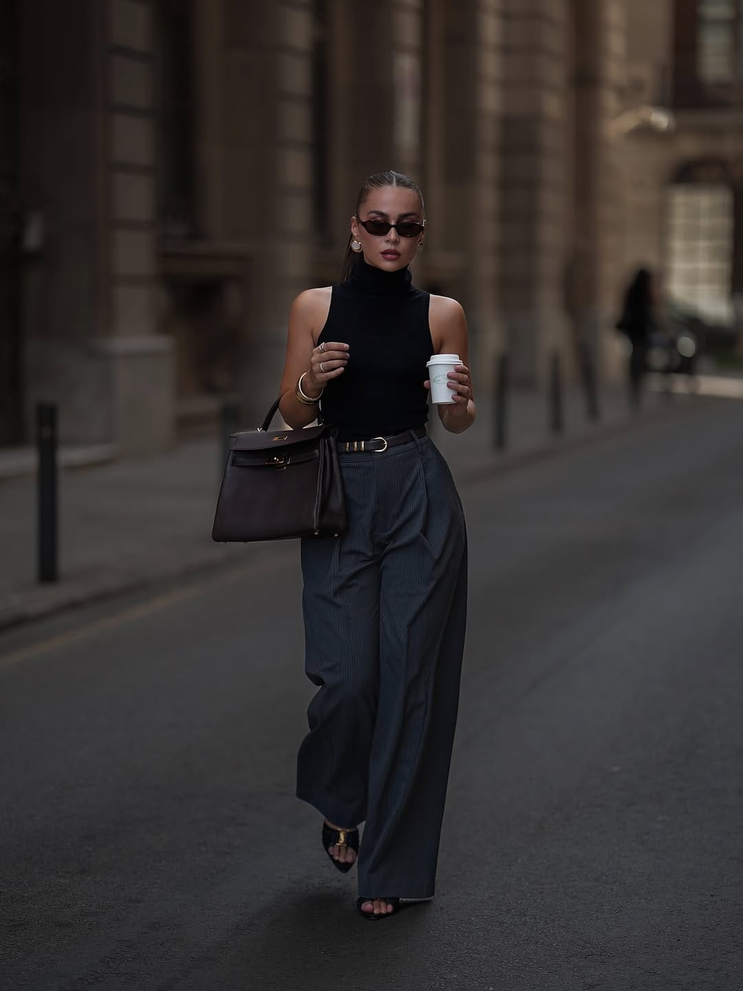 Sleeveless turtleneck with pinstripe trousers smart summer workwear