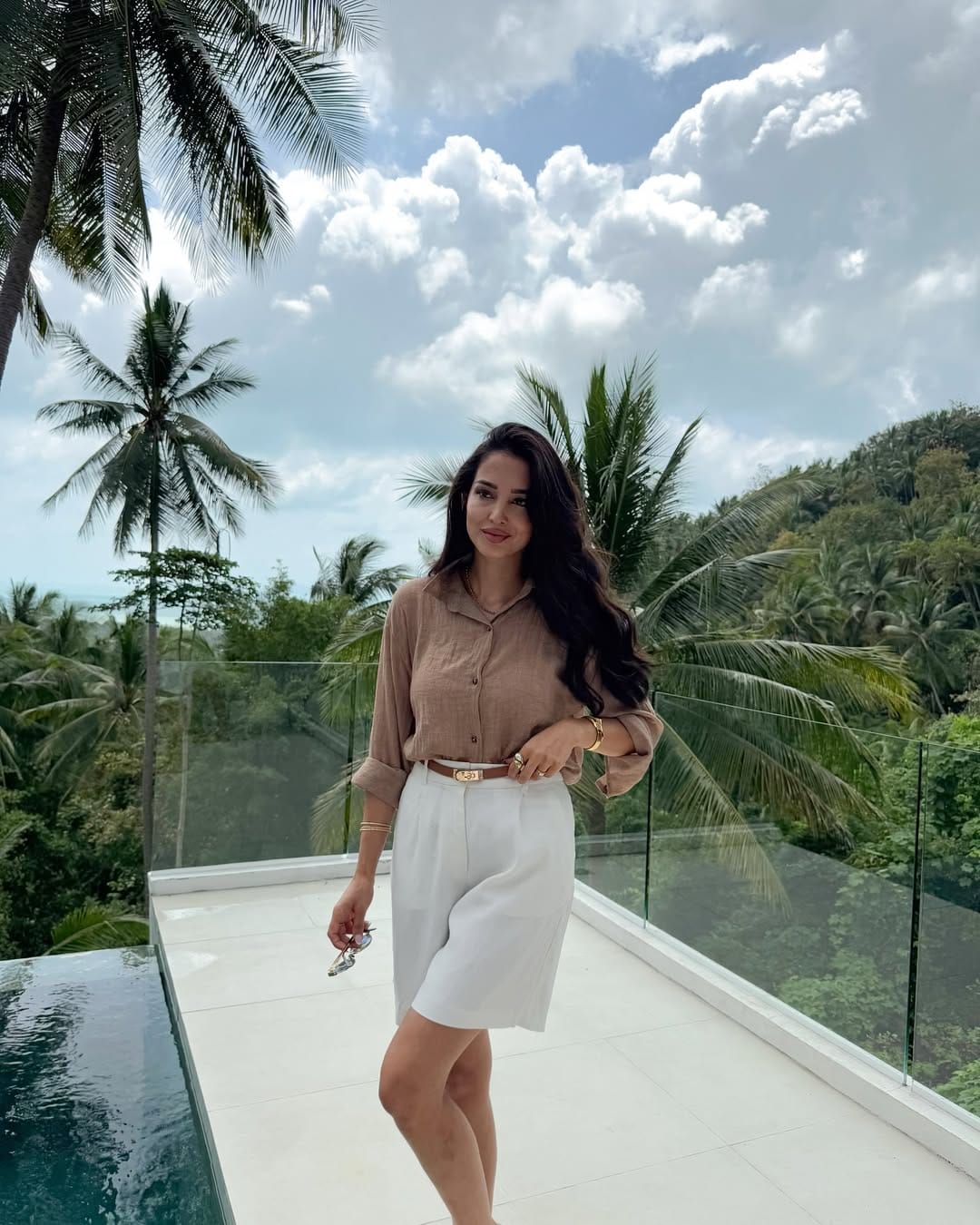 A camel linen shirt styled with a white pencil skirt and a gold belt for a refined, neutral-toned outfit.