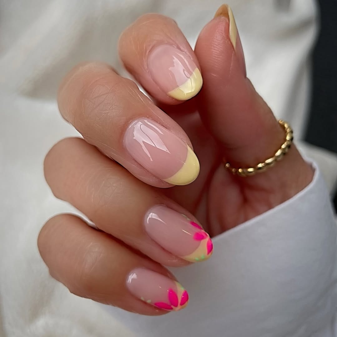 Butter yellow French tip nails with neon flower accent for simple summer nails