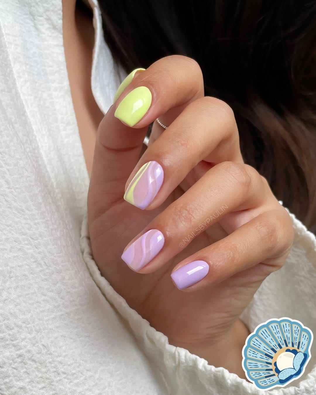 Lime green and lilac swirl two-tone nails for a simple summer nail idea