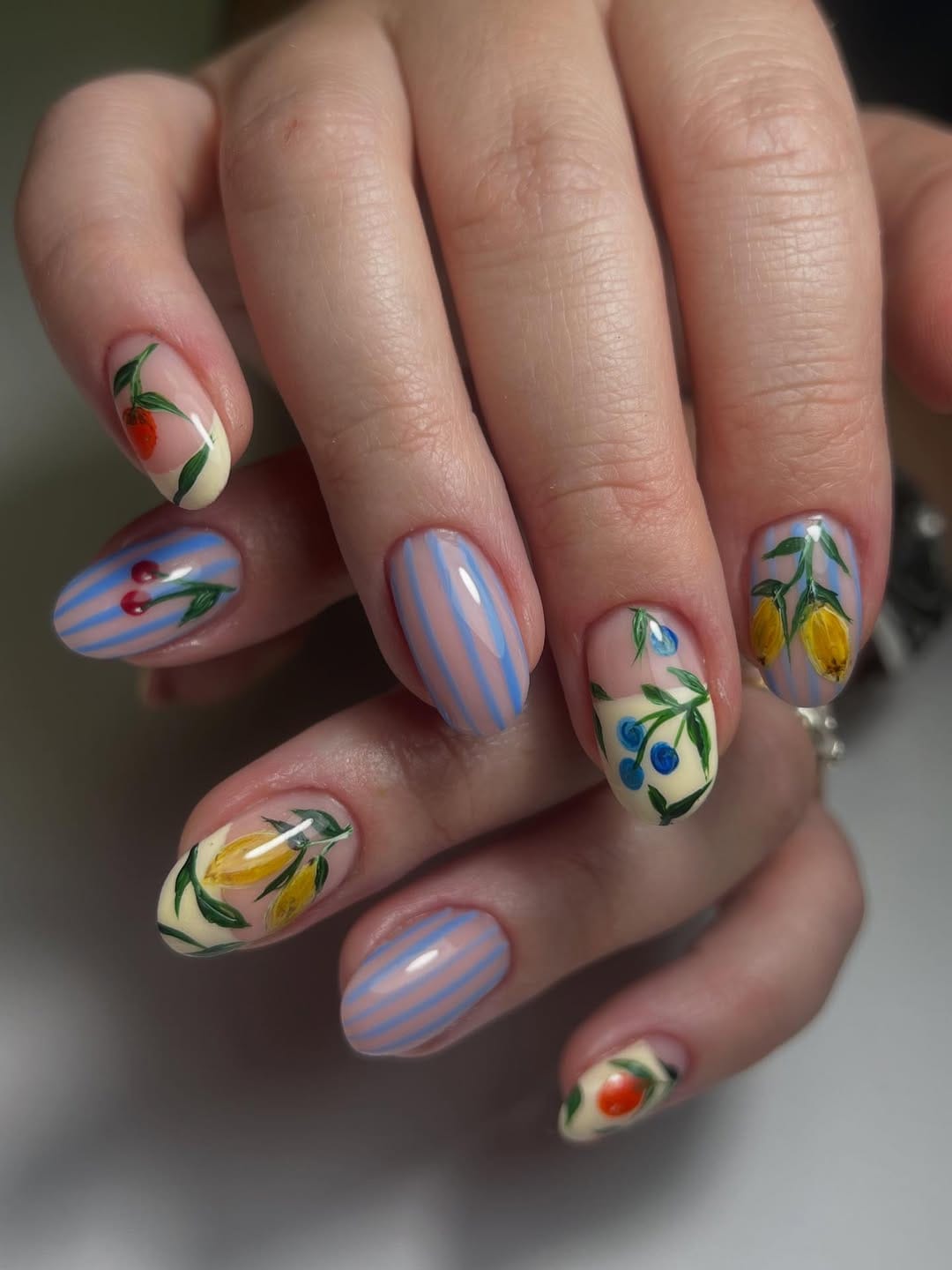 Painted fruit and blue stripe nail art for a fun simple summer nail design