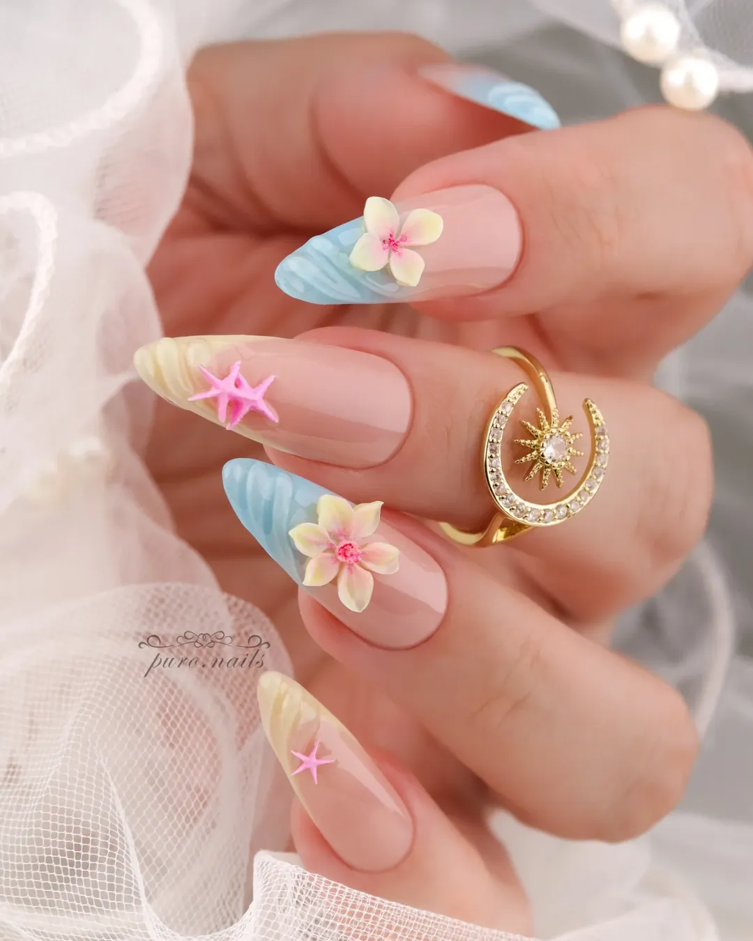 Pastel beach nails with 3D starfish and plumeria for a simple summer nail idea