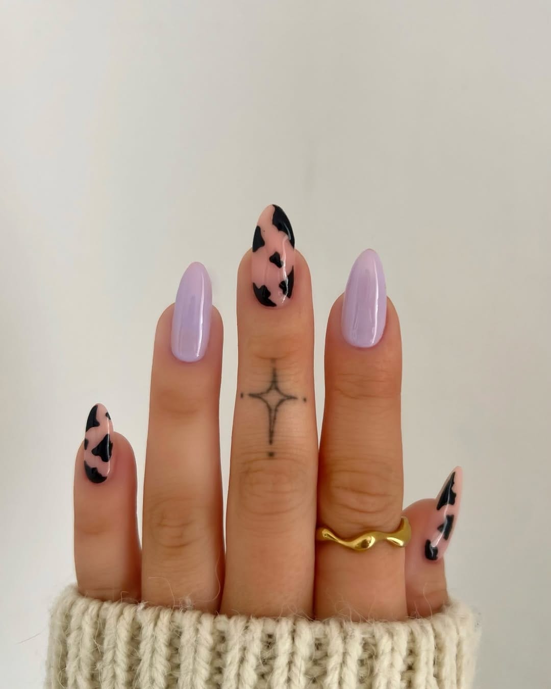 Lilac nails with cow print accent for a simple summer nail idea