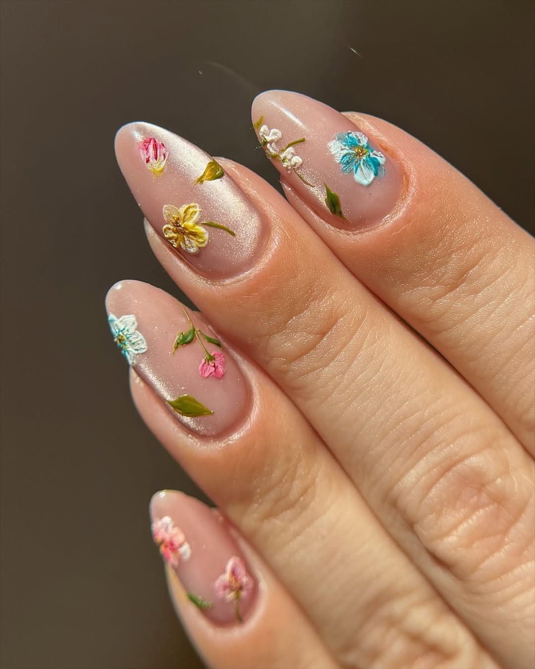 Shimmery botanical garden nails with floral detail for simple summer nails