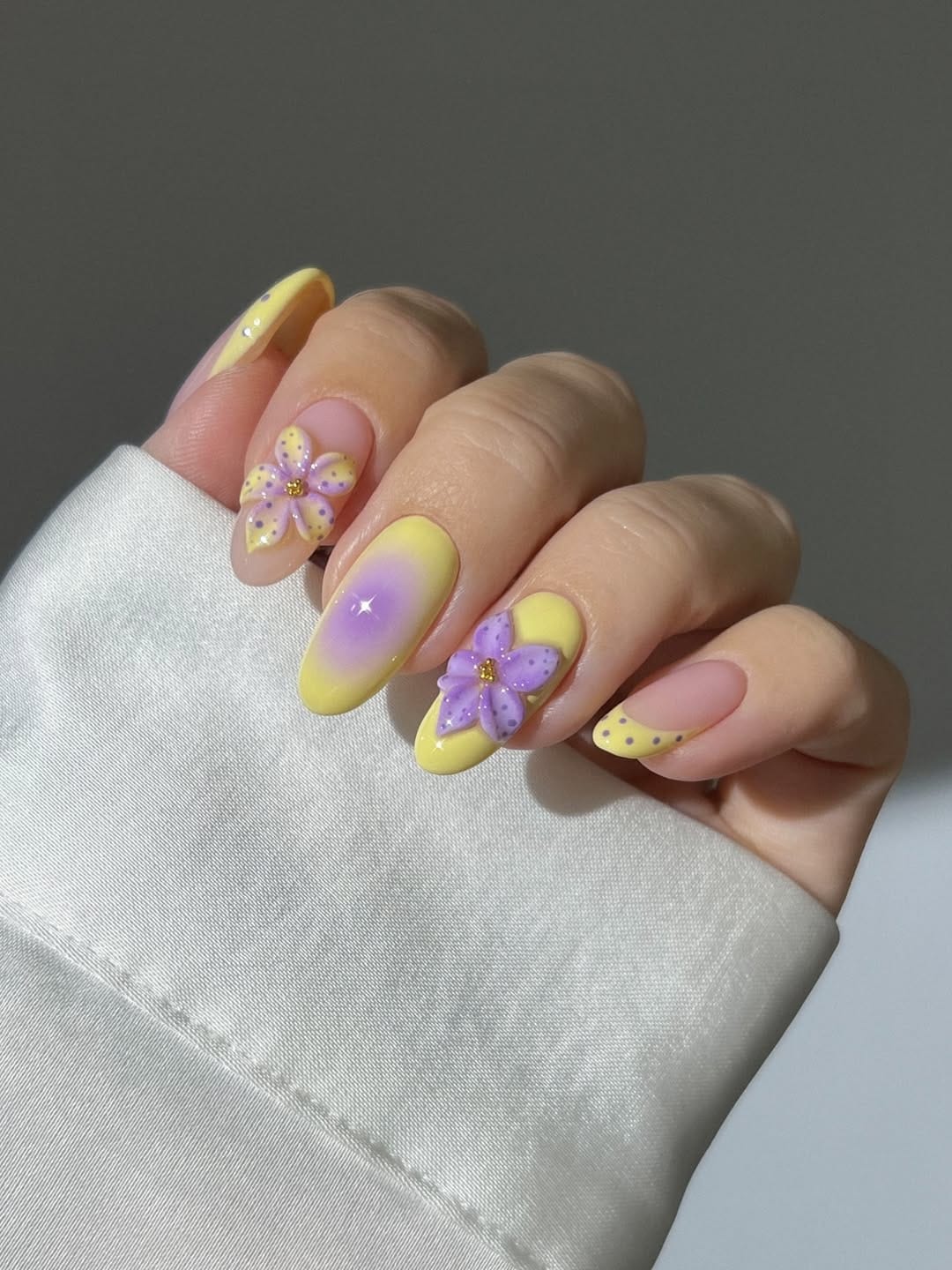 Butter yellow and lilac nails with 3D flower detail for simple summer nails