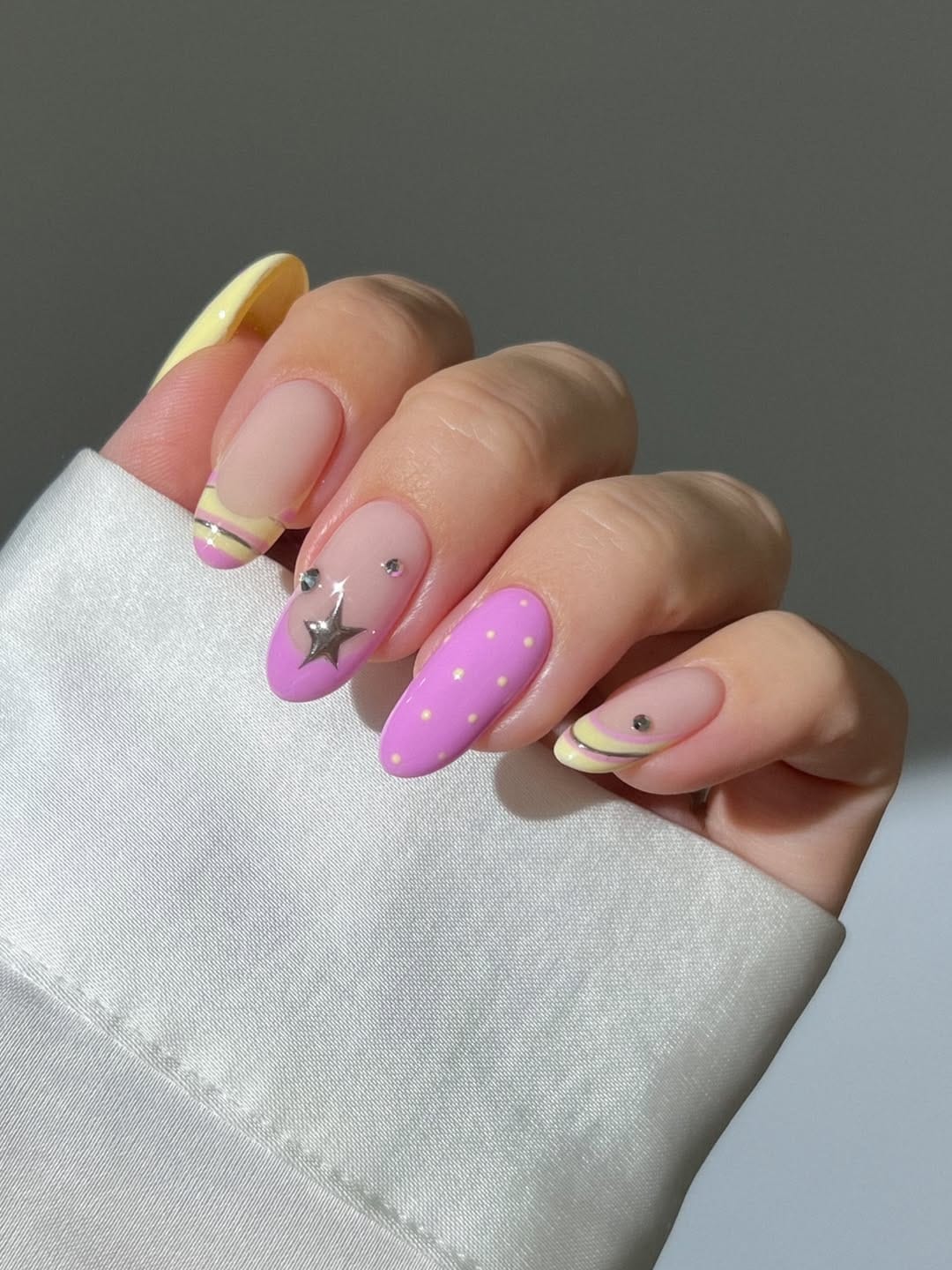 Lilac star nails with yellow French tip for a simple summer nail design